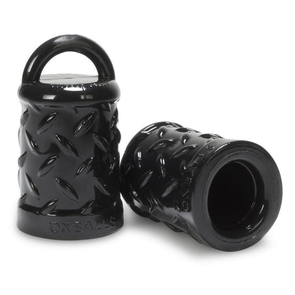 Black textured cylindrical nipple suckers with handle on a white background