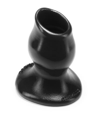 Black anal plug with a central hole on a white background