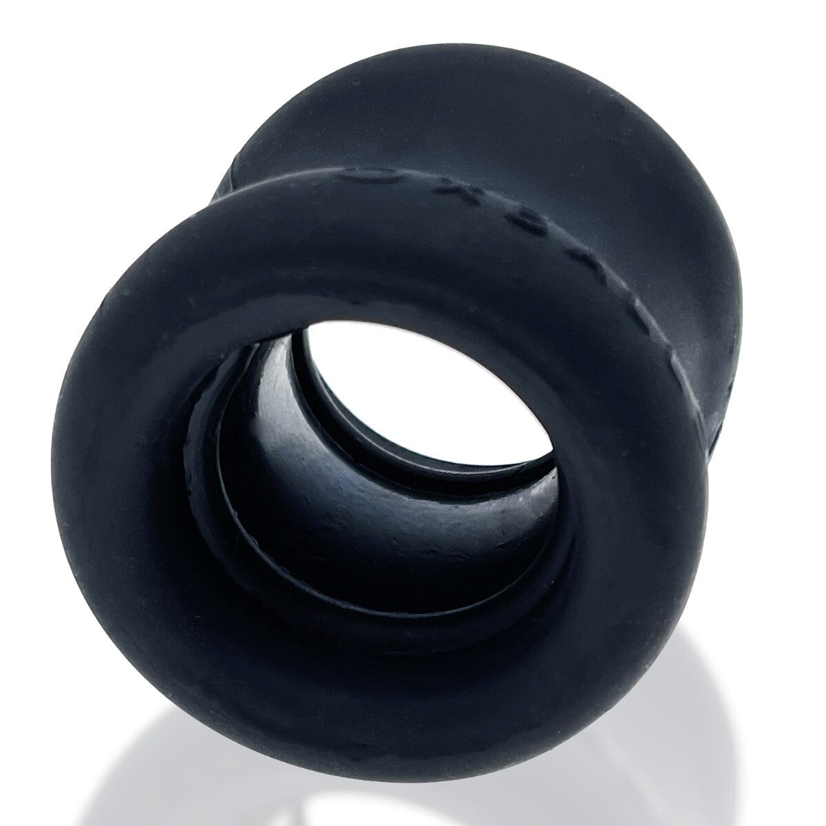 Black silicone cock testicle ring on a white background