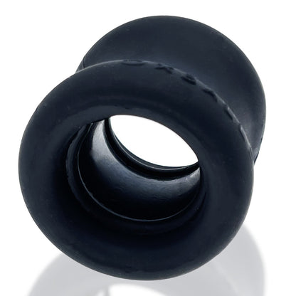 Black silicone cock testicle ring on a white background
