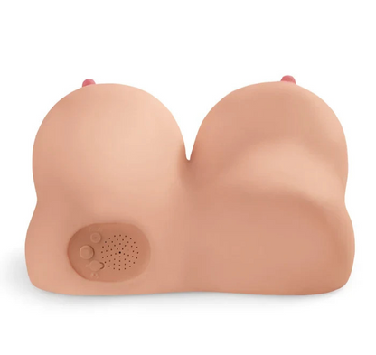 Silicone breast form with a speaker on a white background