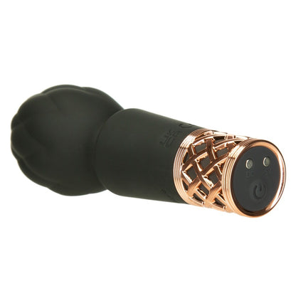 Black and rose gold electronic vibrator on a white background