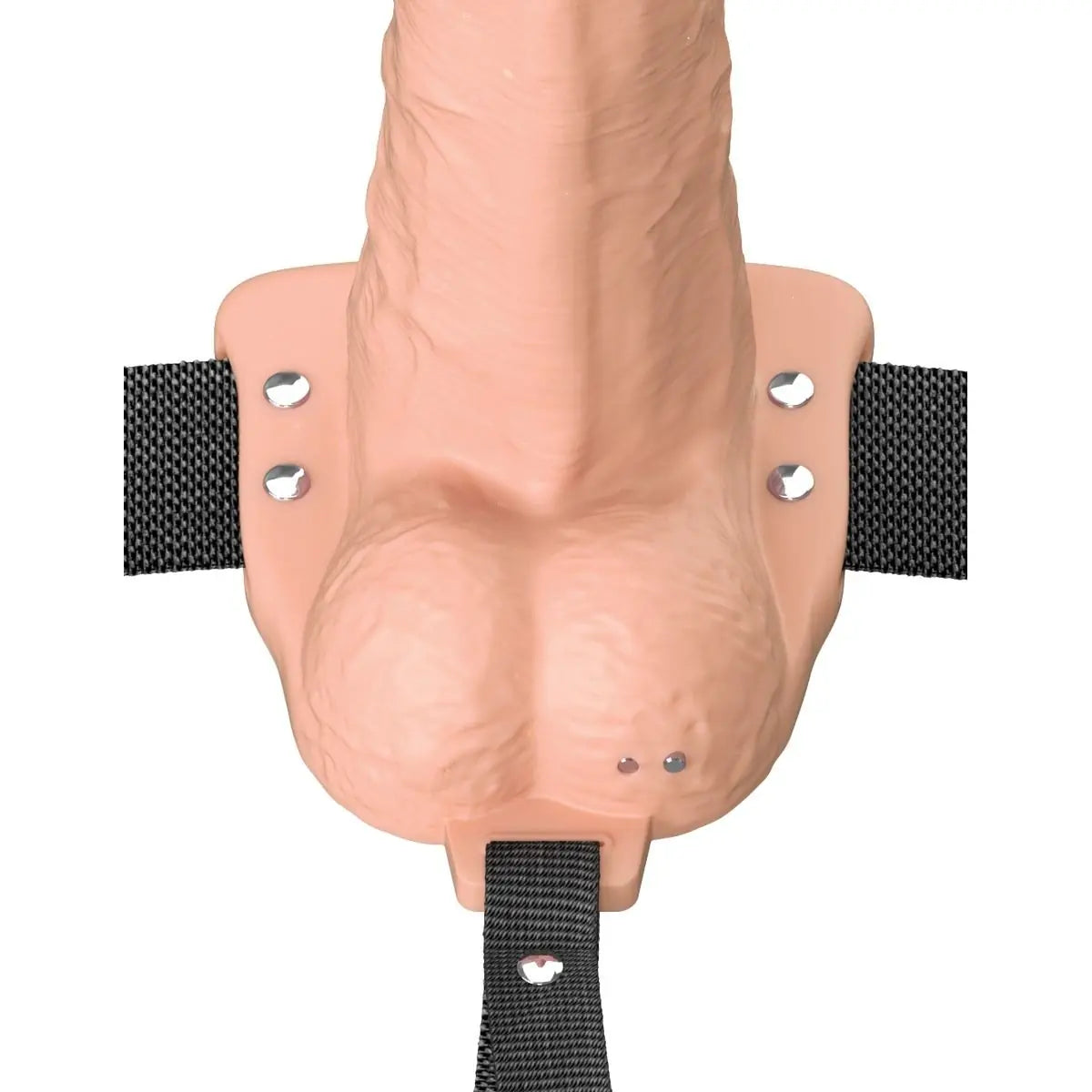 Realistic silicone model of a human penis with black straps on a white background