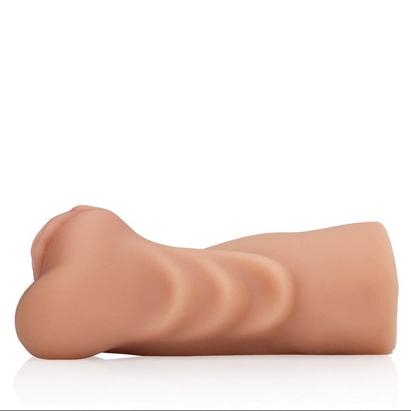 Realistic silicone model of a human pussy on a white background