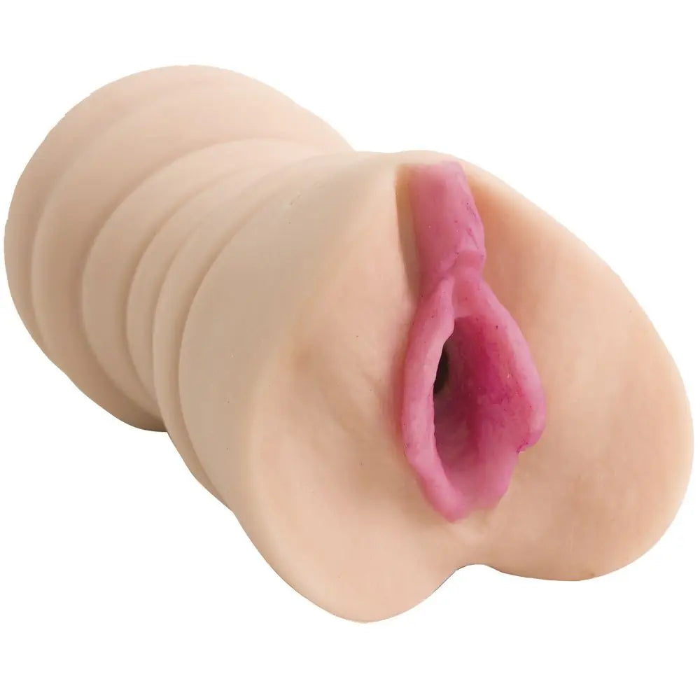 Realistic silicone model of a human vagina on a white background