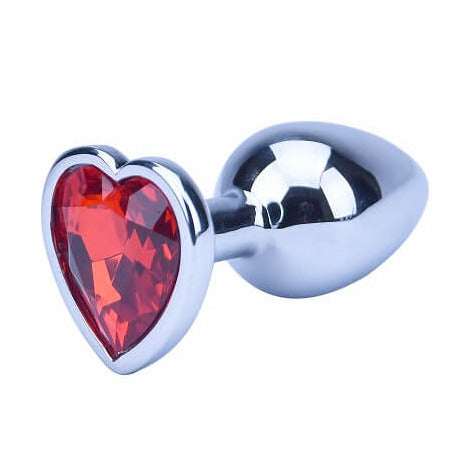Butt plug with red heart-shaped gem and silver casing on a white background