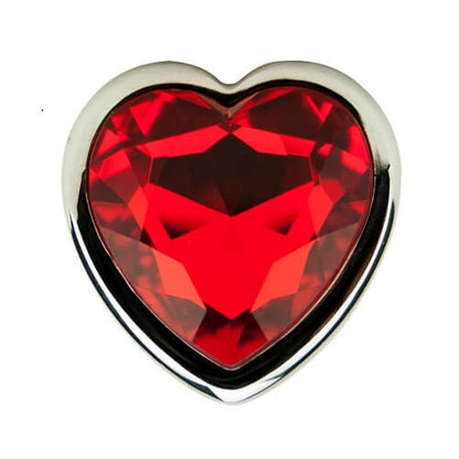 Heart-shaped red gemstone with silver border on a white background