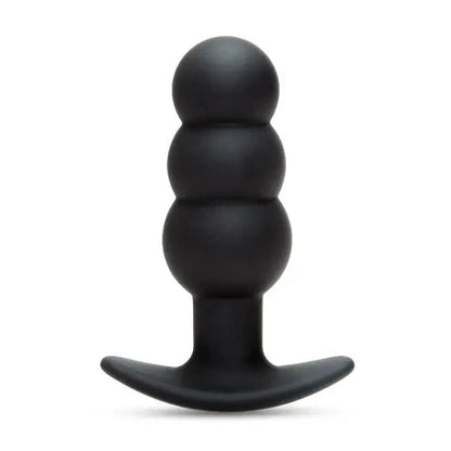 Black silicone butt plug on a white background