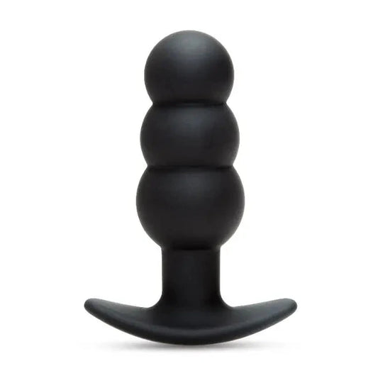 Black silicone butt plug on a white background