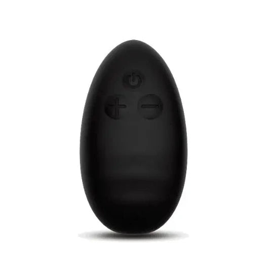 Black egg-shaped massager remote control on a white background