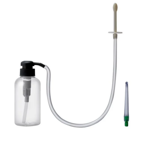 Clear spray bottle with black pump and white hose on a white background