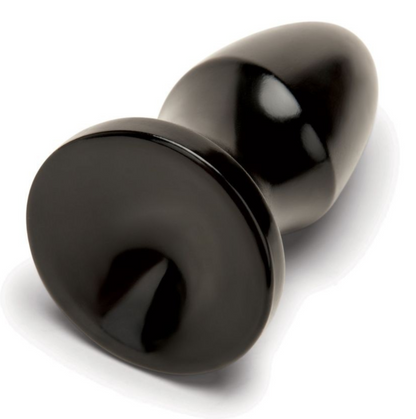 Black anal plug on a white background