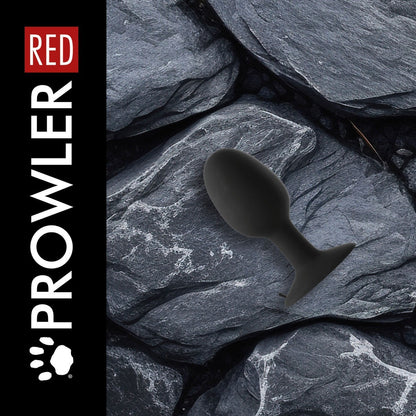 Black sex toy on gray stone surface with 'RED' and 'Prowler' branding.