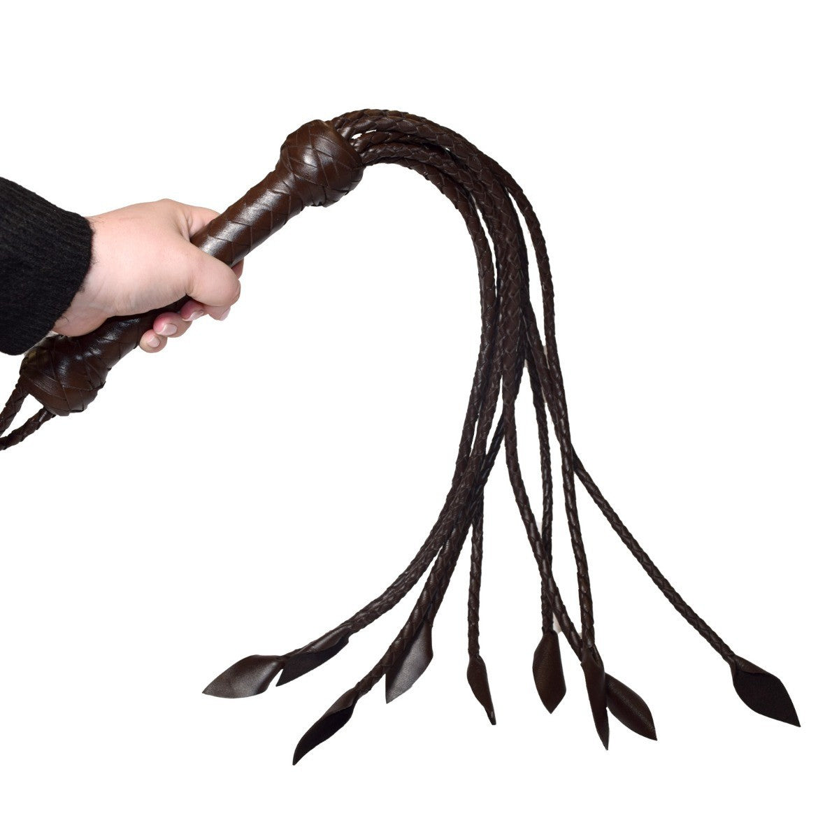 Brown leather whip held by a hand on a white background