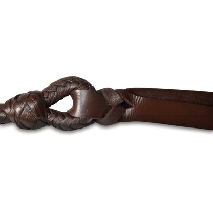Close-up of a braided brown leather whip on a white background
