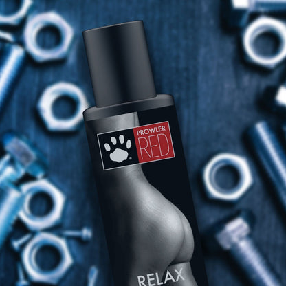 Black bottle labeled 'Prowler Red' with paw print design on a dark background