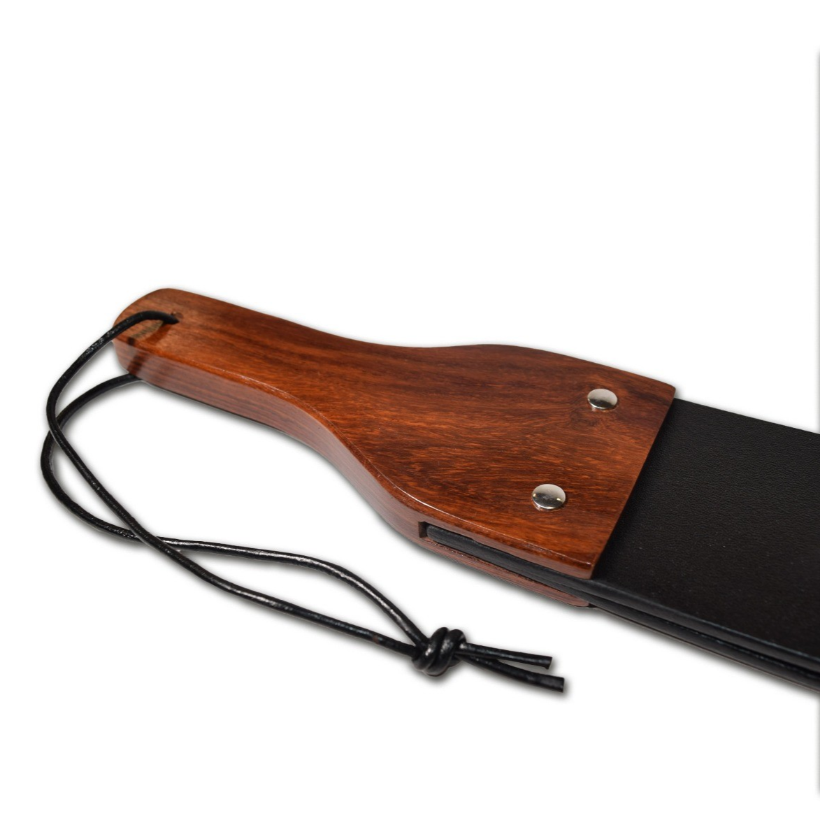 Wooden paddle with a black strap on a white background