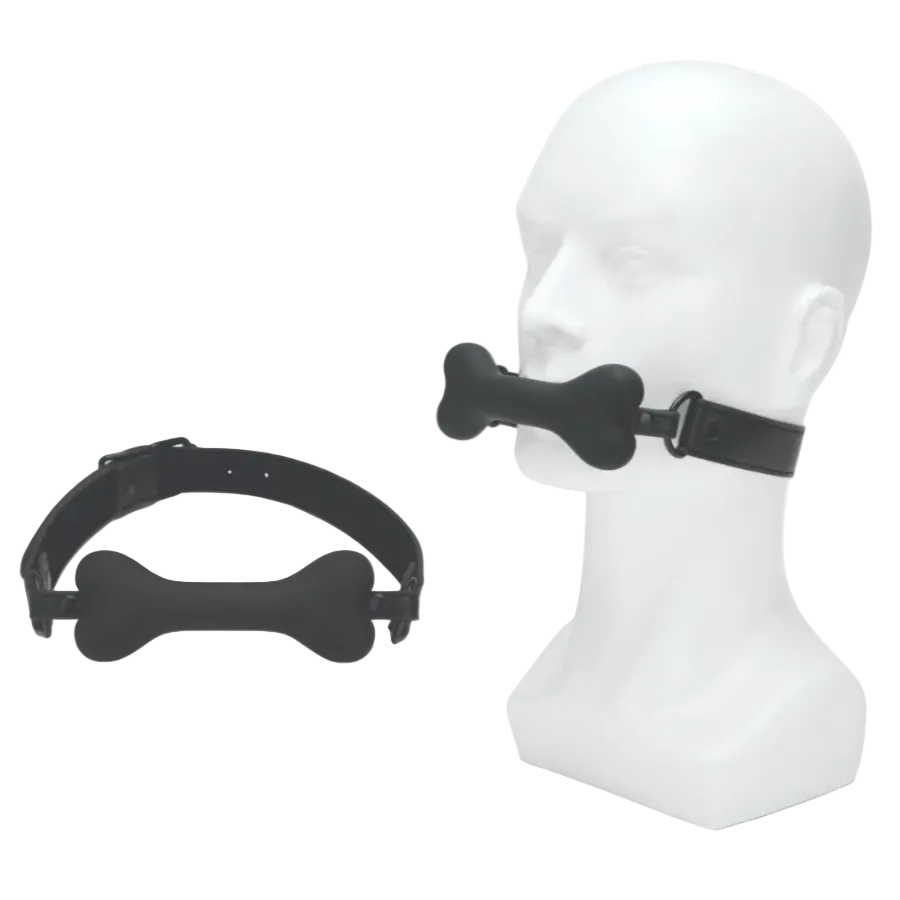 Black bone-shaped muzzle on a mannequin head with another muzzle on a white background