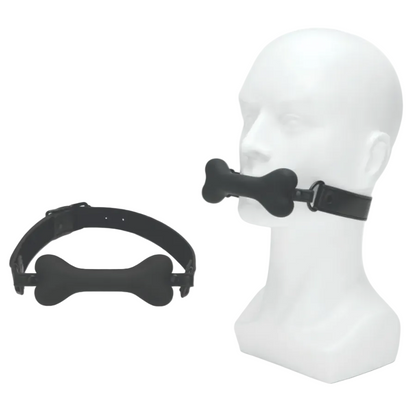 Black bone-shaped muzzle on a mannequin head with another muzzle on a white background