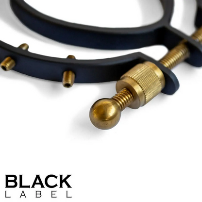 Close-up of a black and gold metal object with 'Black Label' branding.