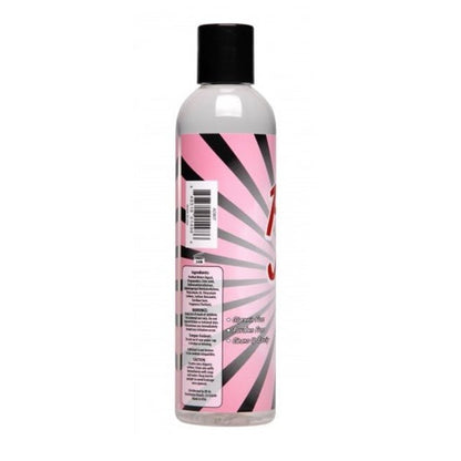 Bottle with a pink and black label on a white background