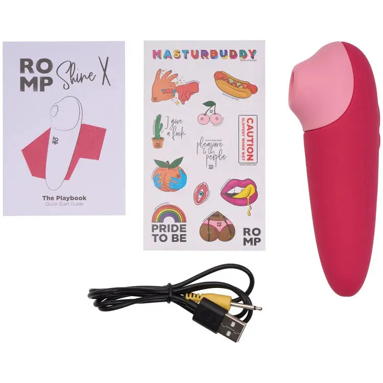 Pink electronic device with packaging and accessories on a white background