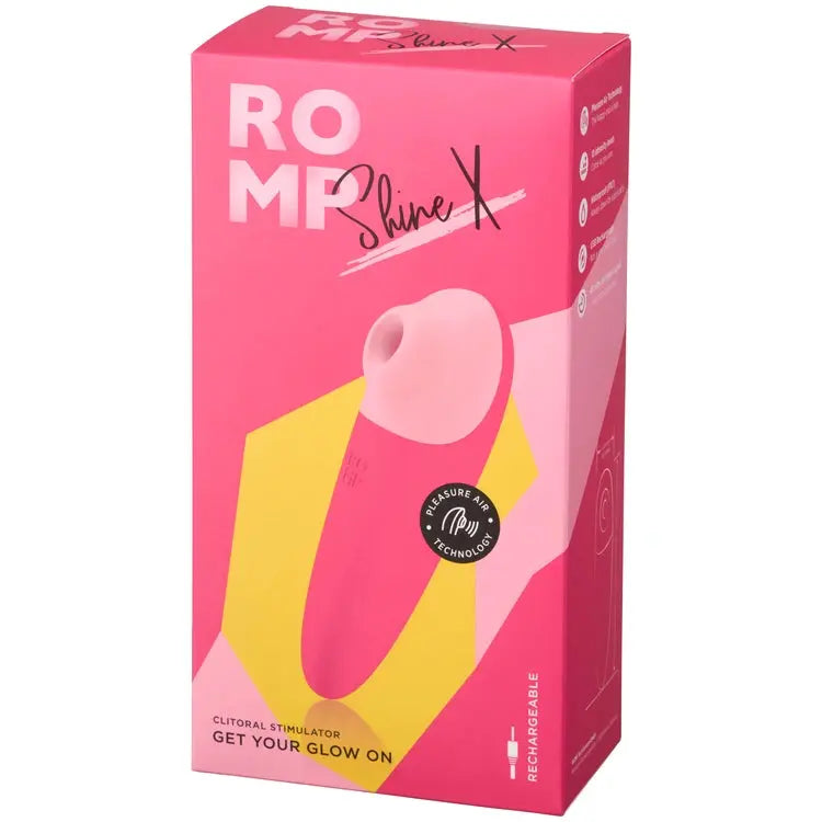 Pink packaging of a clitoral stimulator with 'ROMP' branding on a white background