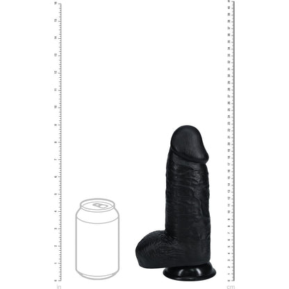 Black silicone dildo with a can for scale on a white background with measurement markings.