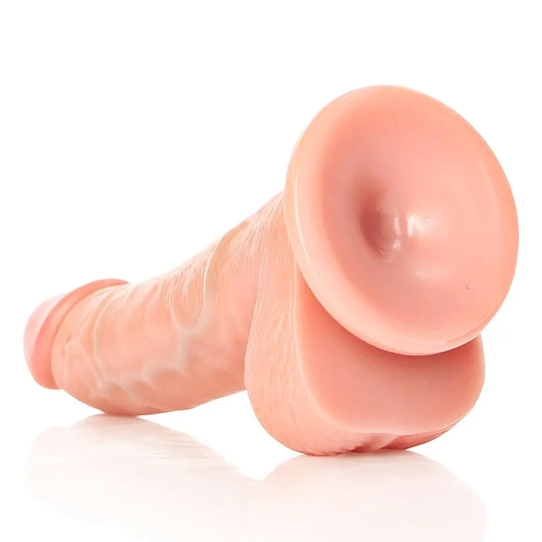RealRock Realistic Curved Suction Cup Silicone Dildo With Balls Pink 6 Inch on a white background