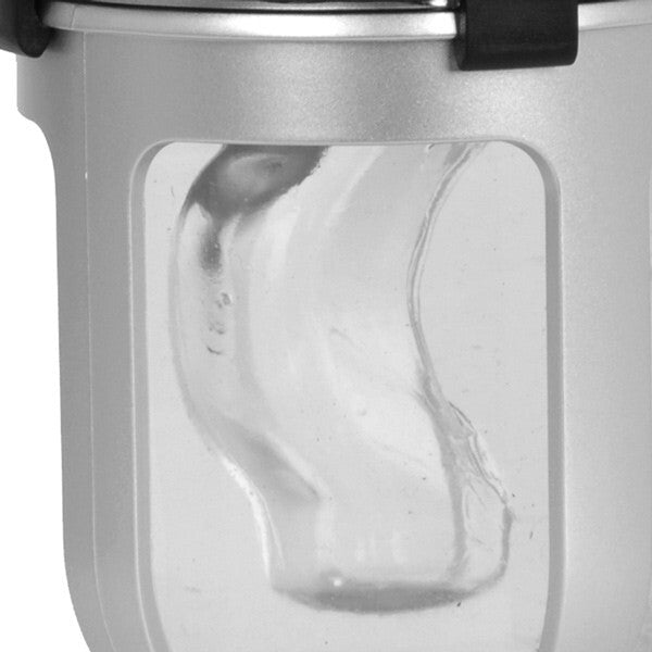Close-up of a metallic container with a clear plastic lid on a white background