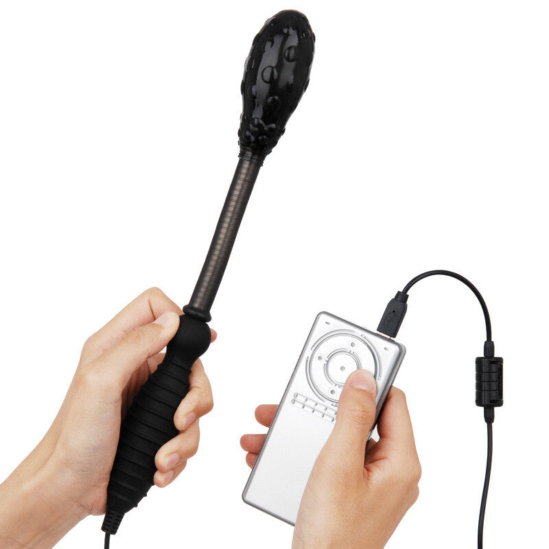 Hand holding a black massage wand with a handheld controller on a white background