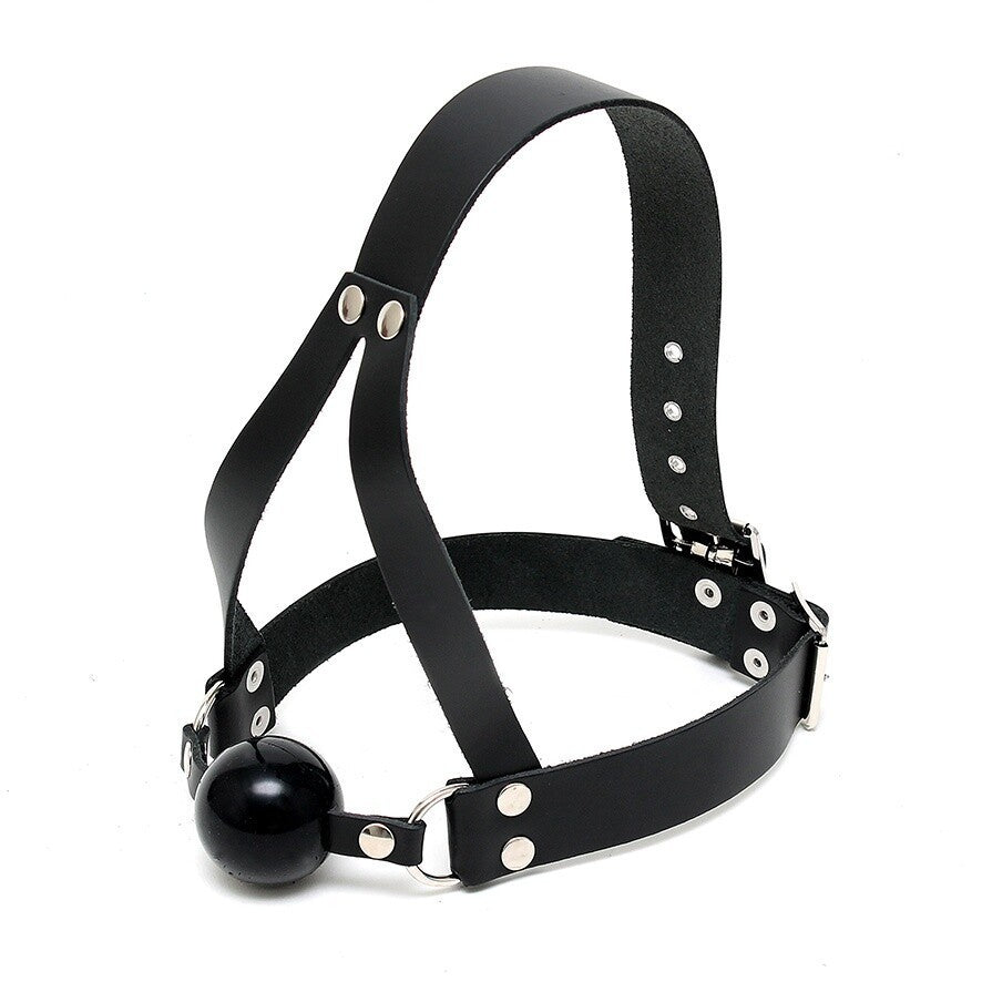 Black leather harness with a ball on a white background