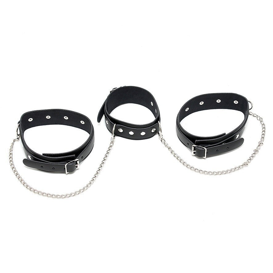 Three black leather cuffs with chains on a white background