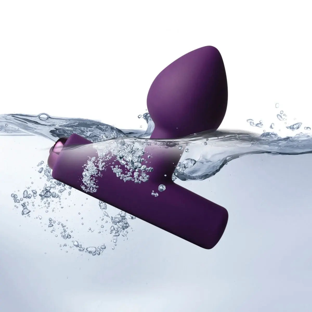 Purple silicone anal plug massager with water splashes on a white background