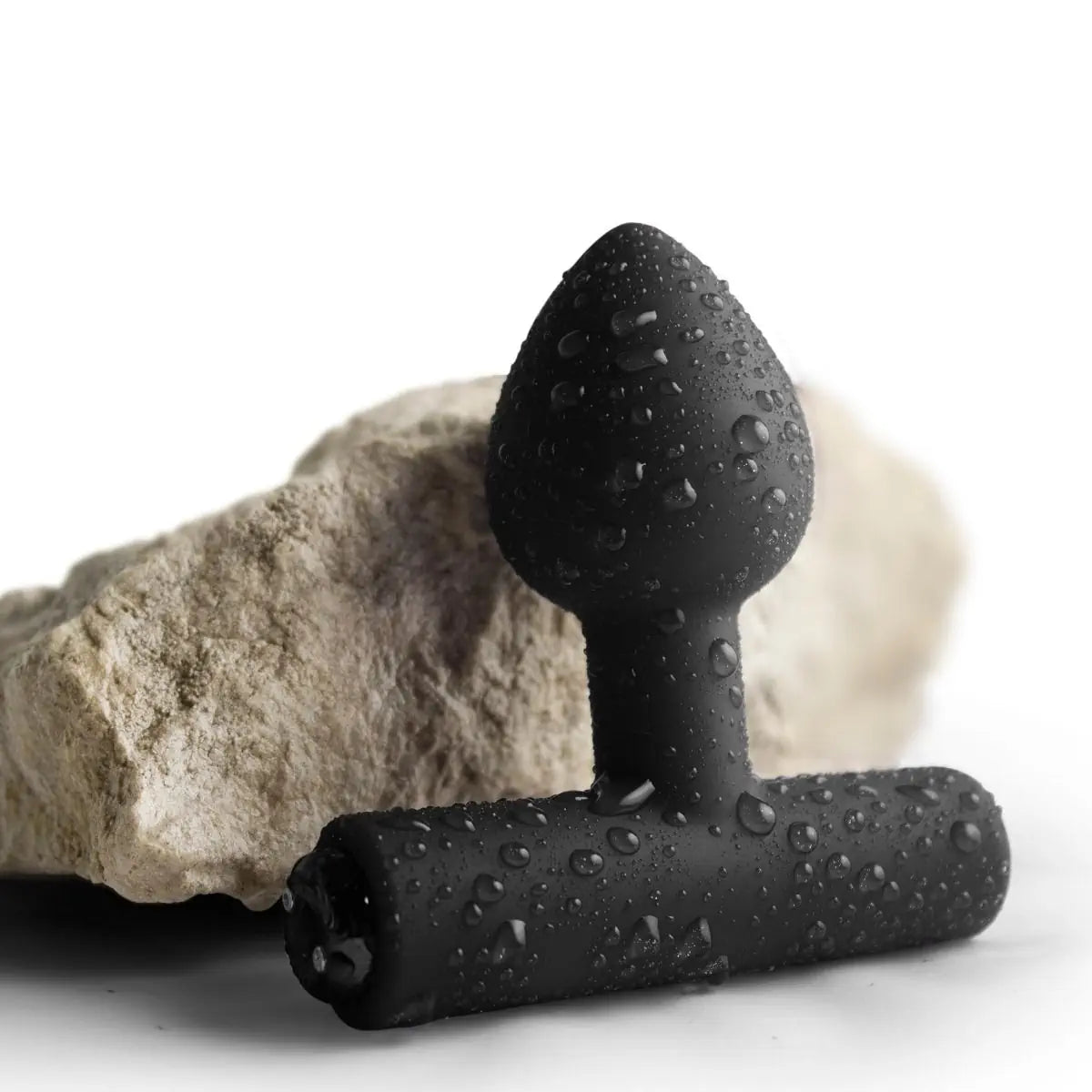 Black textured anal plug on a white background