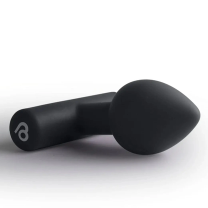 Black butt plug massager on a white background
