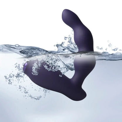 Purple silicone product partially submerged in water with bubbles