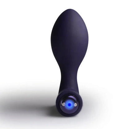 Purple electronic mssage device with a blue light on a white background