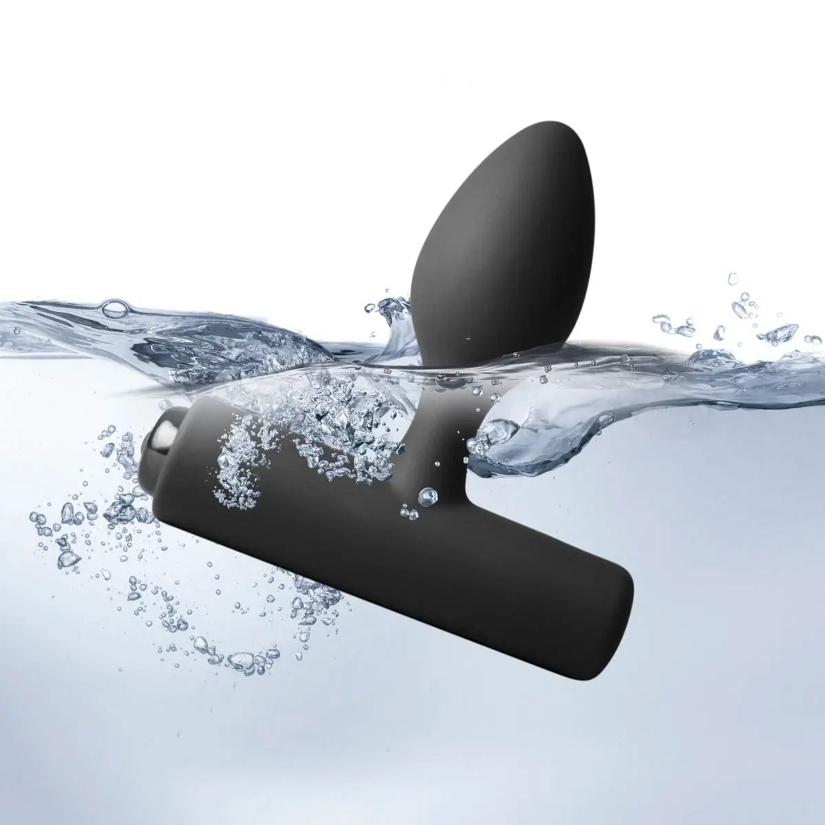 Black anal plug partially submerged in water with bubbles around it