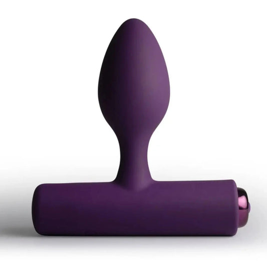 Purple silicone butt plug on a white background