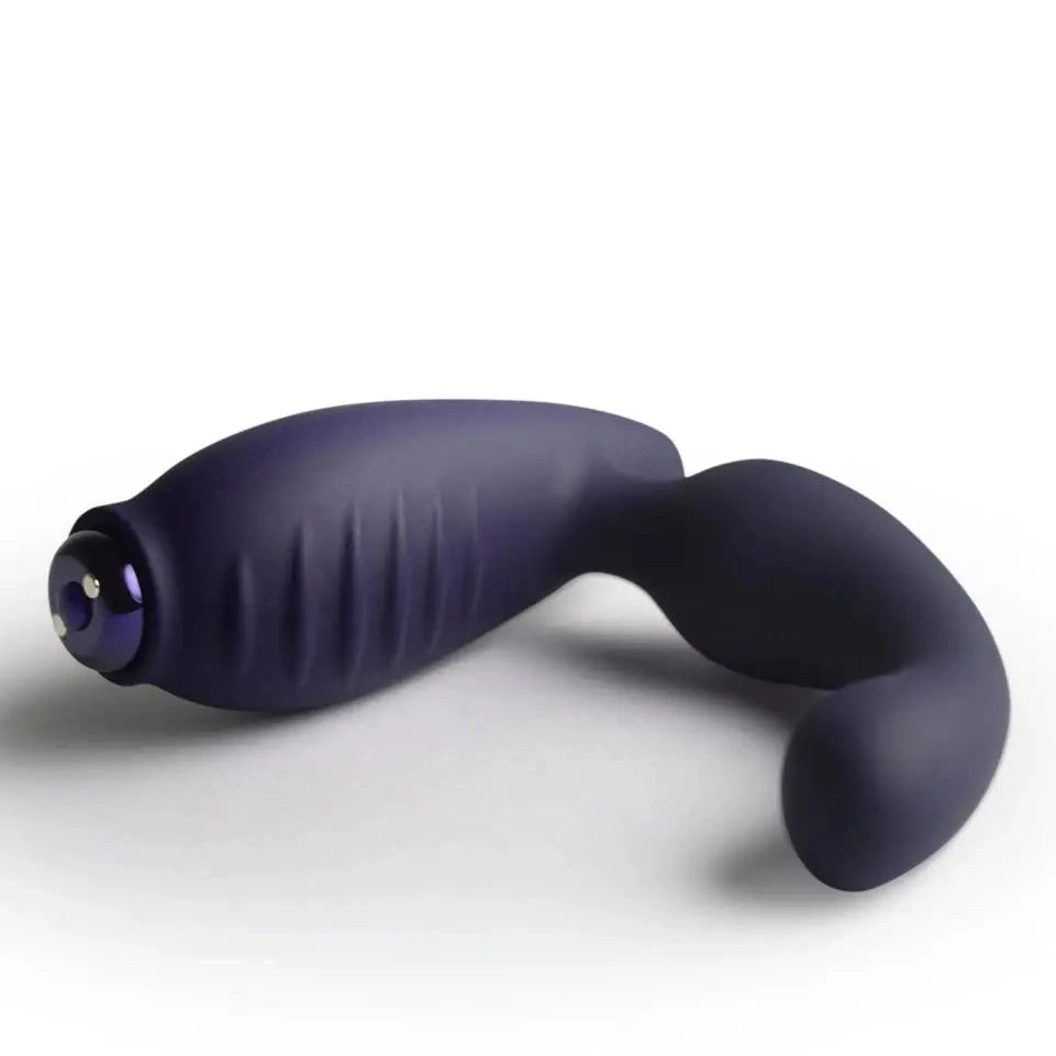 Black silicone butt plug on a white background