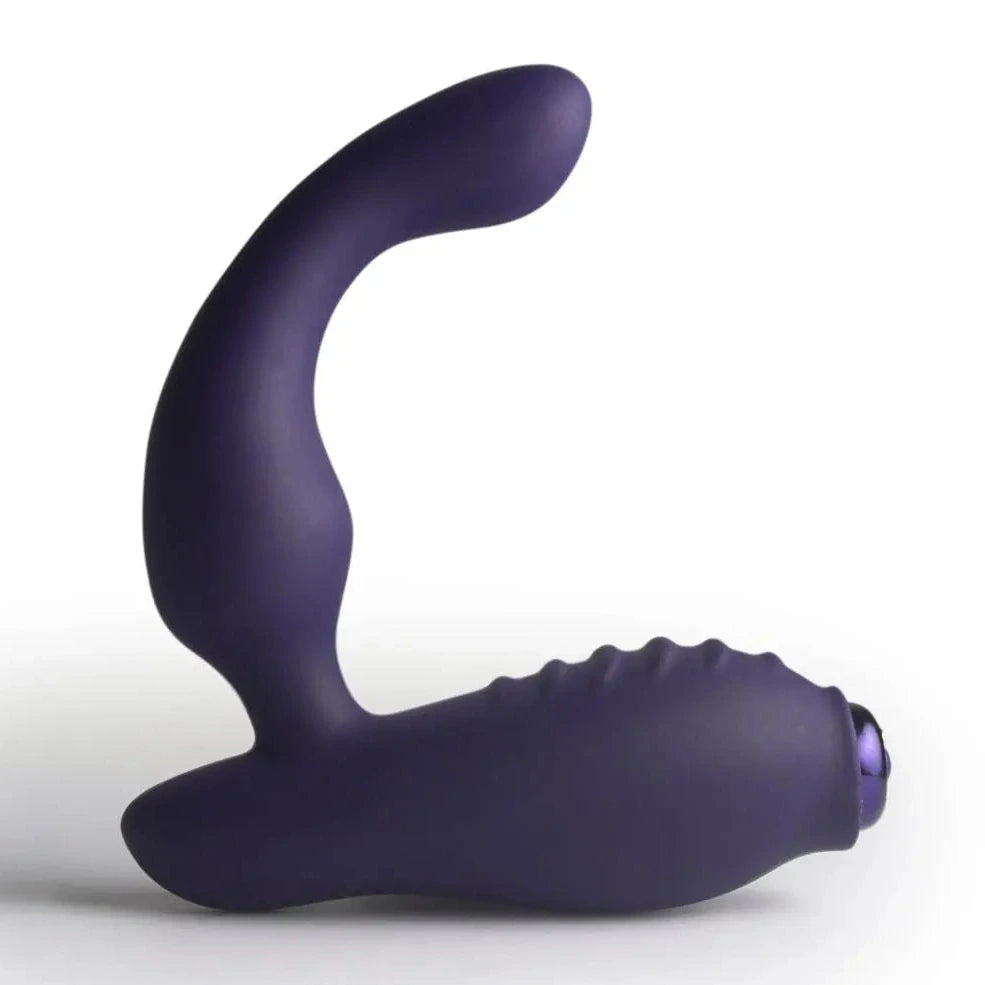 Purple silicone butt plug on a white background