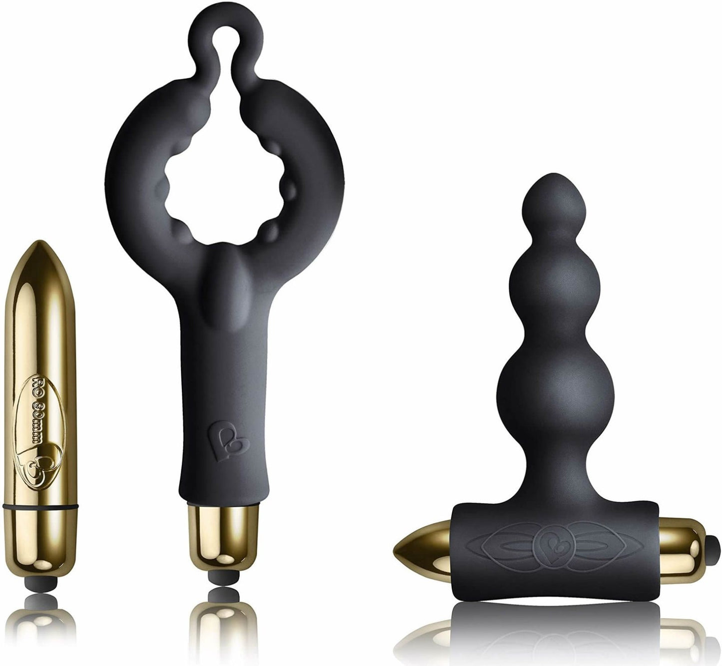 Three black and gold sex toys on a white background
