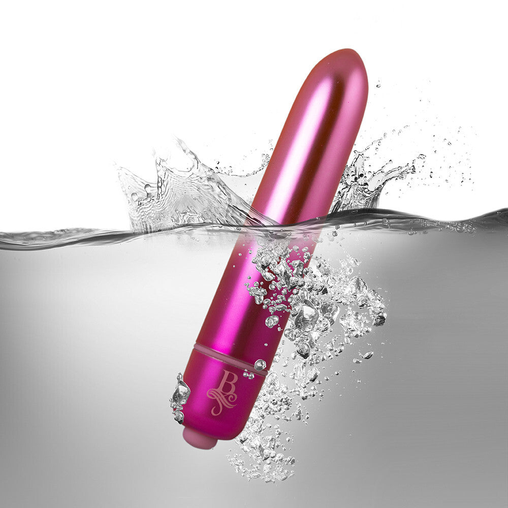 Pink electronic device with brand logo emerging from water on a gray background