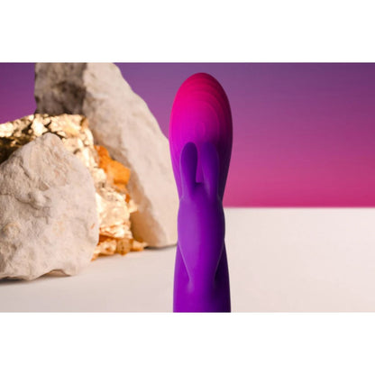 Purple silicone product against a purple and white background
