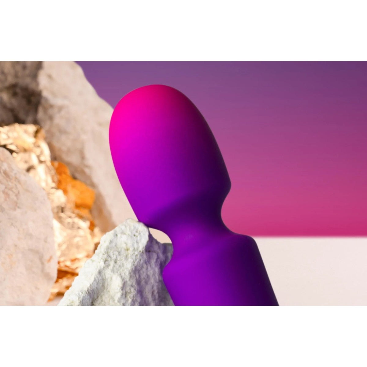 Purple object on a natural background with a pink gradient