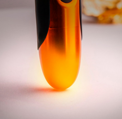Close-up of a glowing orange object on a blurred background