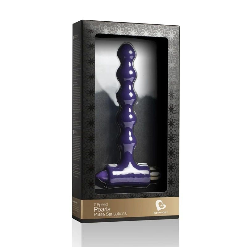 Purple sex toy in a black box packaging on a white background