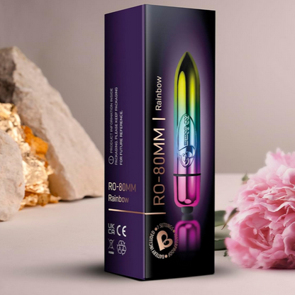 Vibrator packaging with a rainbow design on a neutral background