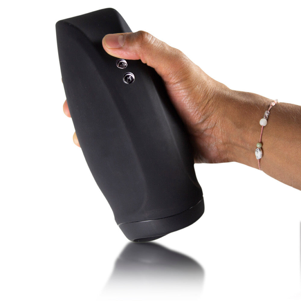 Hand holding a black cylindrical device with two buttons on a white background